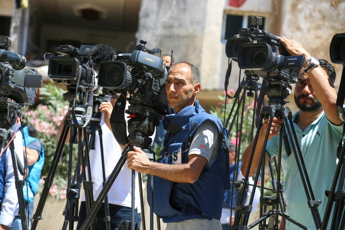 Photographer capturing images at an awards ceremony